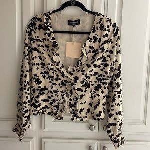 Kittenish cow print blouse
